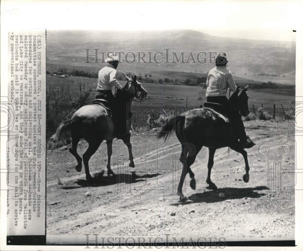 1974 Press Photo Men riding horses &amp; delivering mail in Montrose, Colorado - Historic Images