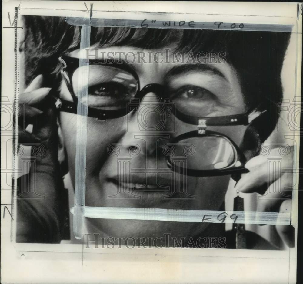 1967 Thomas Demonstrates New Style Eyeglasses For Eye Makeup Wearers-Historic Images