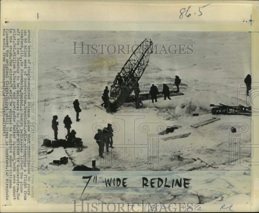 1968 Men work around wreck of Stinson plane in ice, Greenland-Historic Images