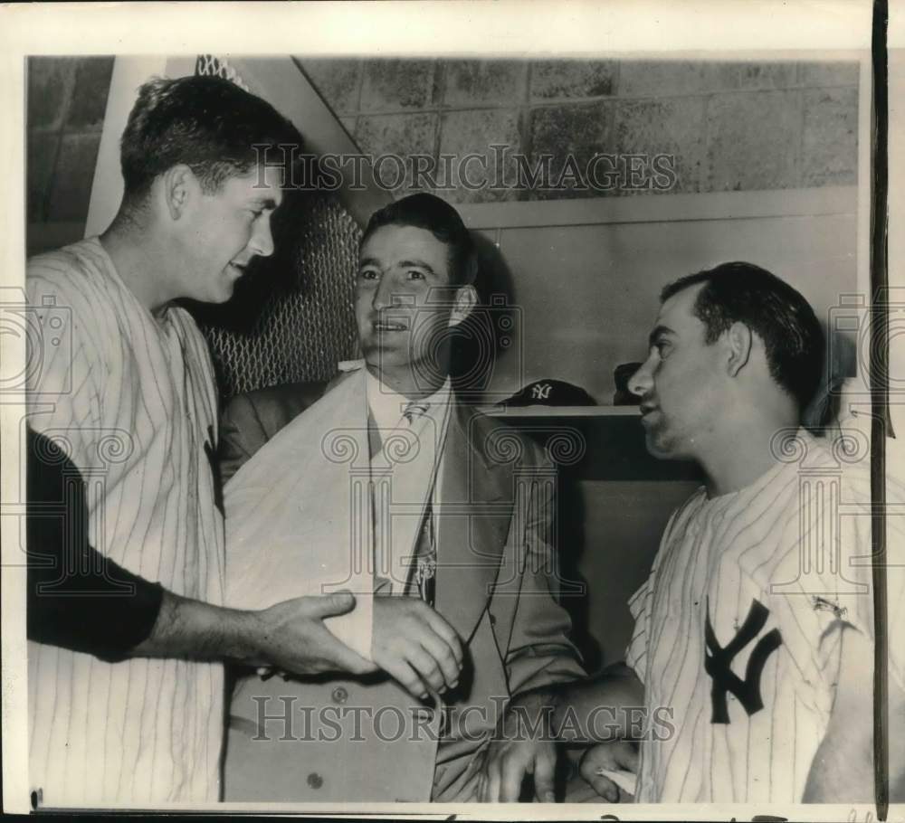 1949 Press Photo Baseball player Yogi Berra checking on colleague&#39;s injured arm- Historic Images