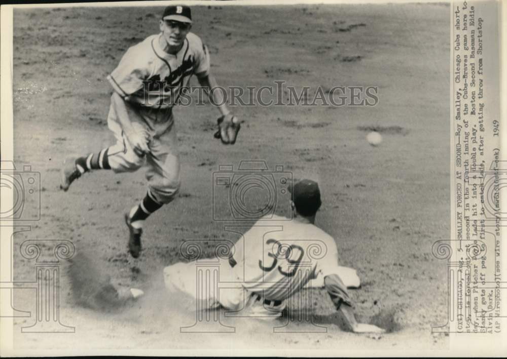 1949 Press Photo Chicago Cubs&#39; Roy Smalley slides under Braves&#39; Eddie Stanky, IL- Historic Images