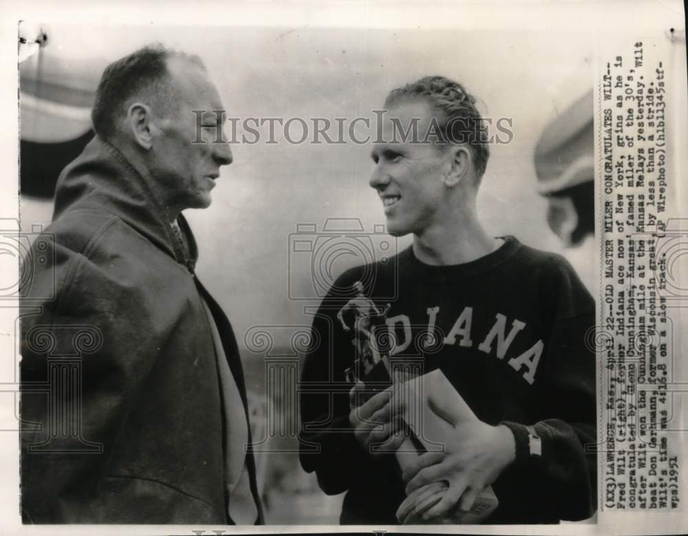 1951 Press Photo Fred Wilt with trophy congratulated by Glenn Cunningham, KS - Historic Images