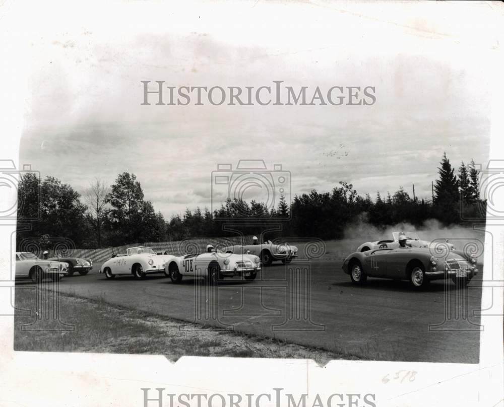 1957 Press Photo Amateur car racers on MGA sports cars - pix33738 - Historic Images