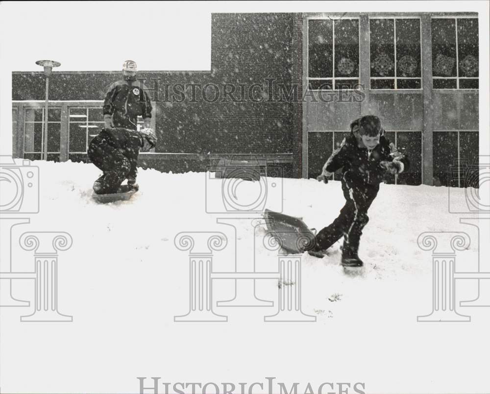 1992 Press Photo Boys Sledding Down Hill in Snow - pna07502 - Historic Images