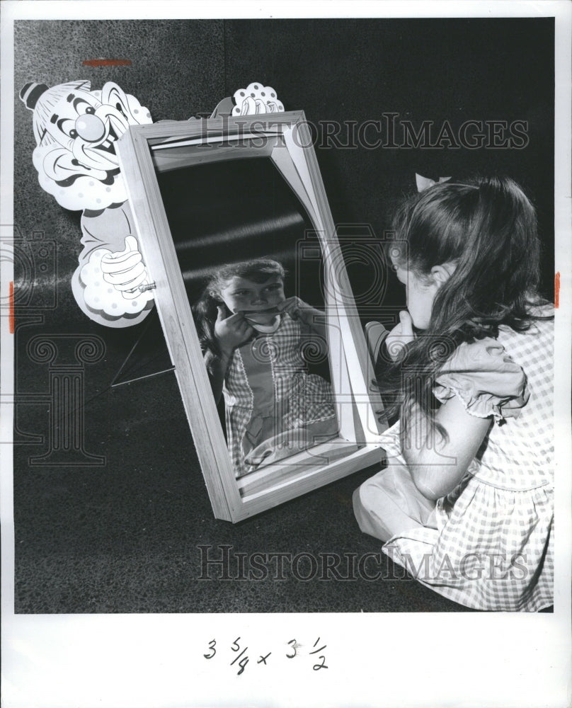 1963 Young Girl Making Faces Into Mirror - Historic Images
