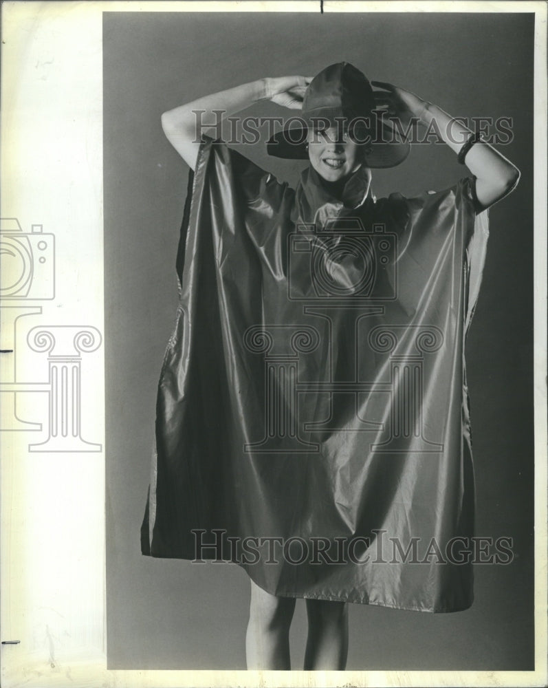 1984 Raincoat modeled - Historic Images