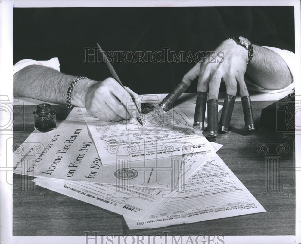 1959 Income Tax nails paper - Historic Images