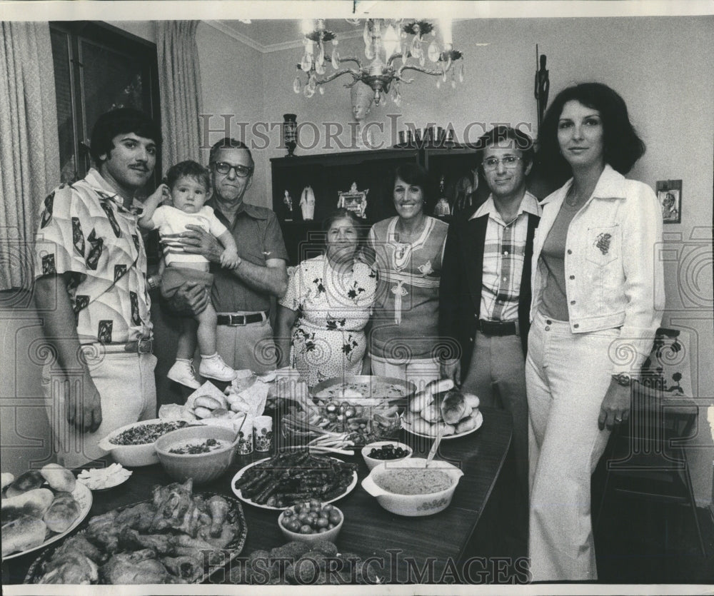 1977  Hassan family gathers at the dinner - Historic Images