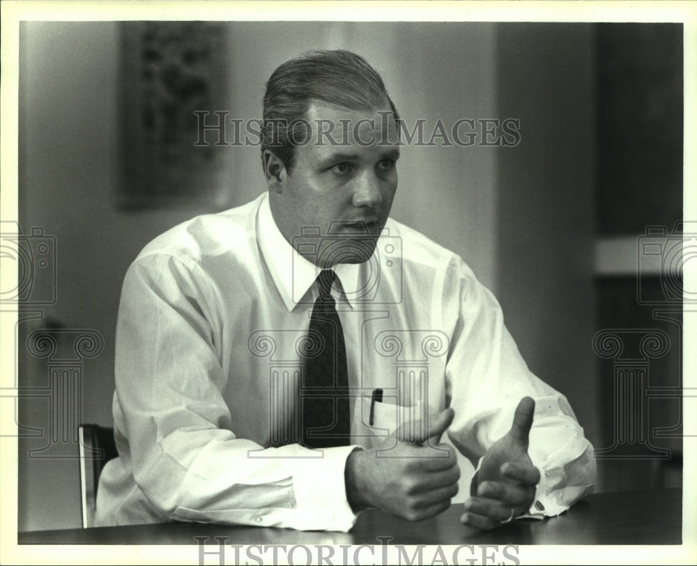1994 John Agather, Local Businessman at Conference Room Interview - Historic Images