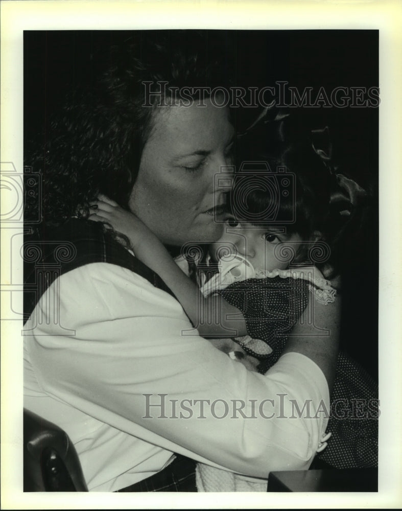1992 Cheryl Peacock and adoptee Annie at Bexar County Courthouse - Historic Images