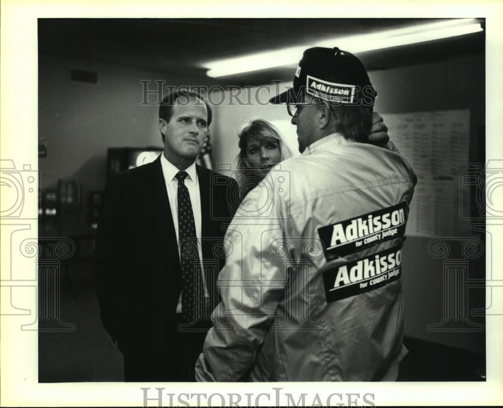 1992 County judge candidate Tommy Adkisson talks with a supporter - Historic Images