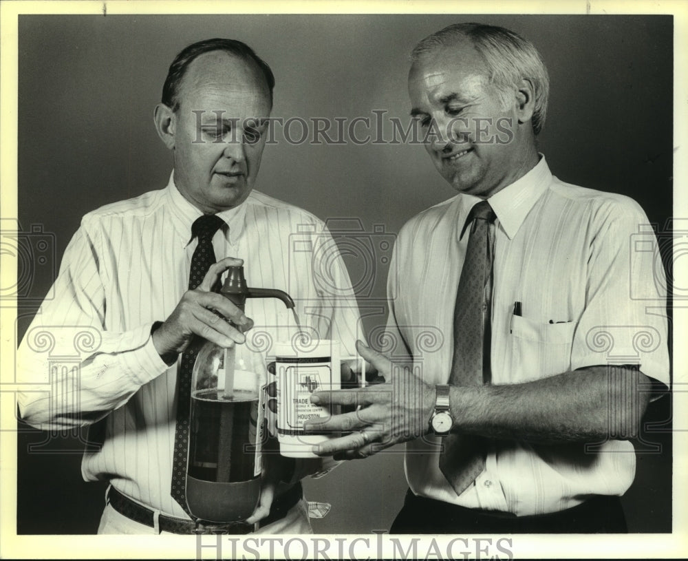 1988 Tex Pro Cola Tap officials demonstrate their product - Historic Images