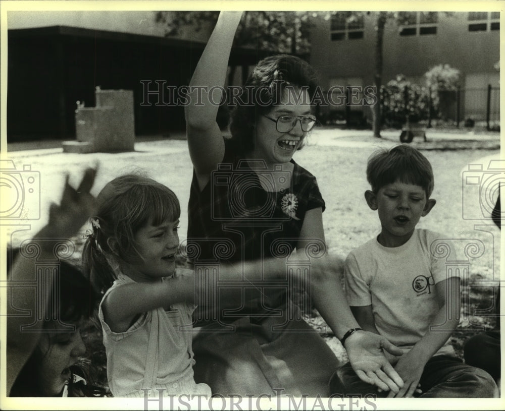 Press Photo Teacher Peggy Apple with students on playground - saa01416 - Historic Images