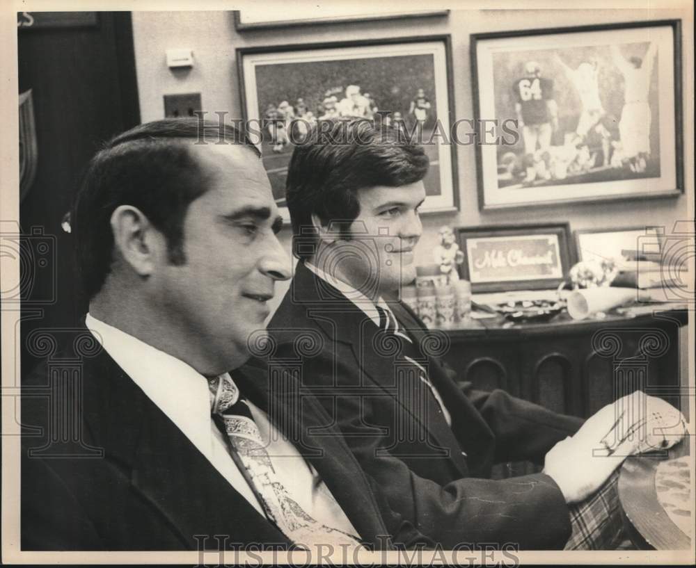 James Ashley and Mike Gravitt in Office with Football Photos - Historic Images