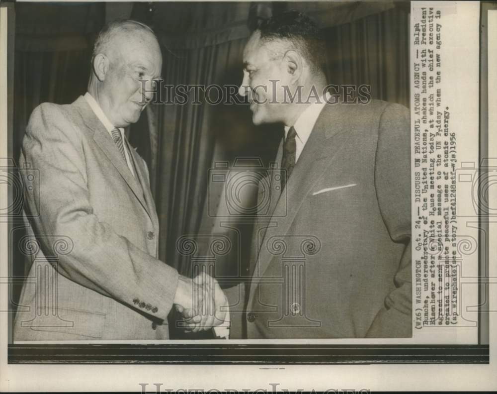 1956 Press Photo Ralph Bunche shakes hands with President Eisenhower at Meeting - Historic Images