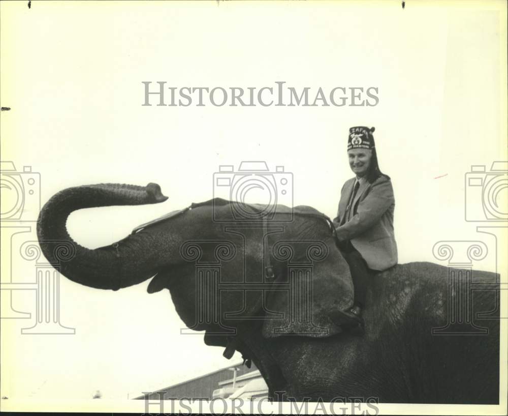Knox Duncan, Bexar County Republican Chairman Rides Elephant &quot;Tess&quot; - Historic Images