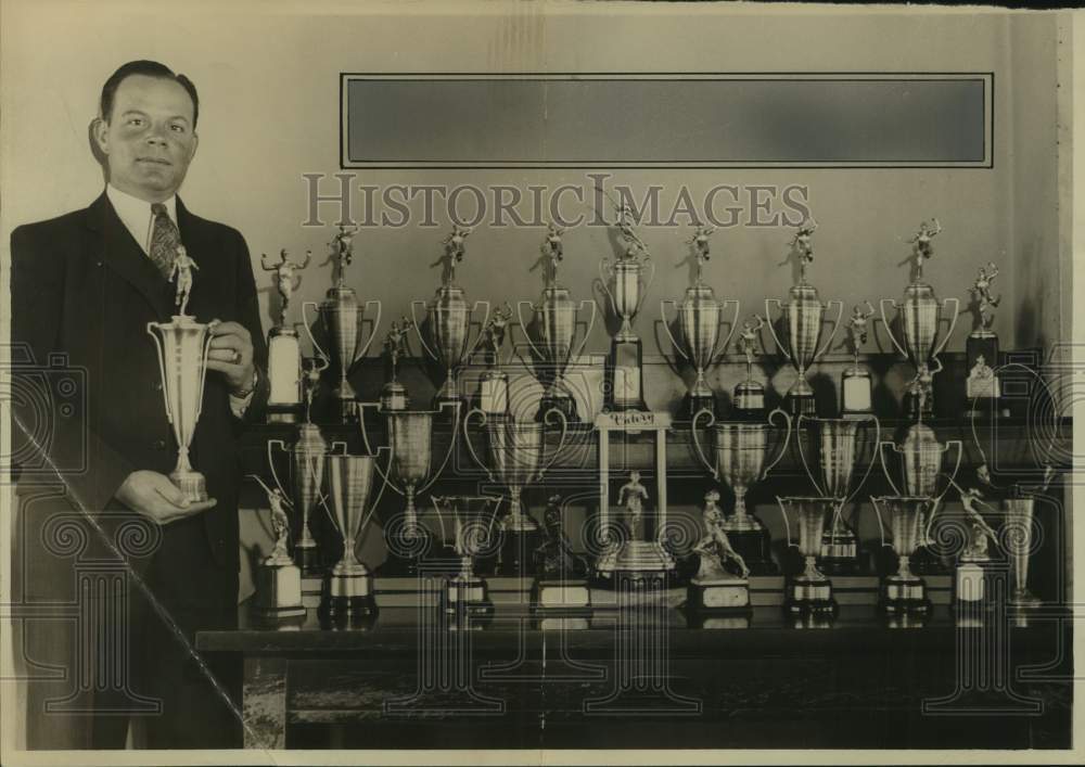 Press Photo Terrell F. Gates, principal of Burbank School with numerous trophies - Historic Images