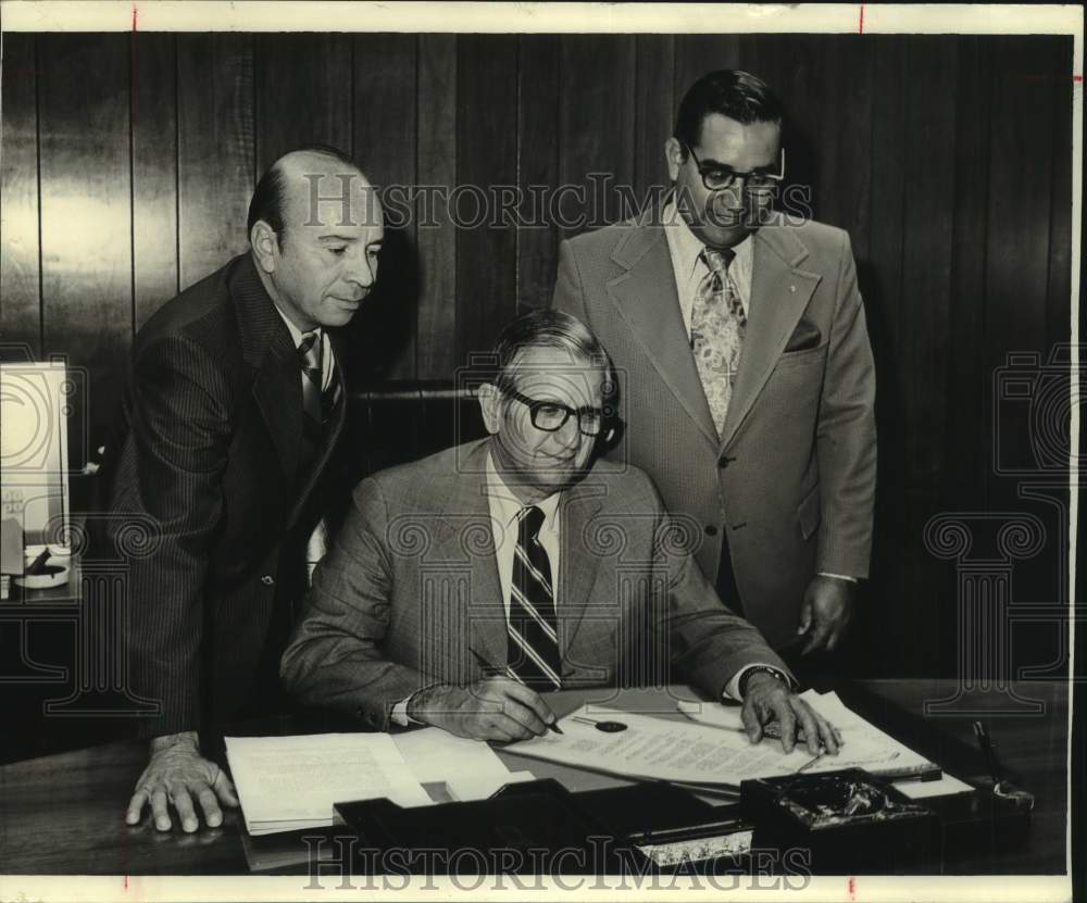 City Mayor John Gatti with Rudy Ximenez, Richard Larrunhide at desk - Historic Images