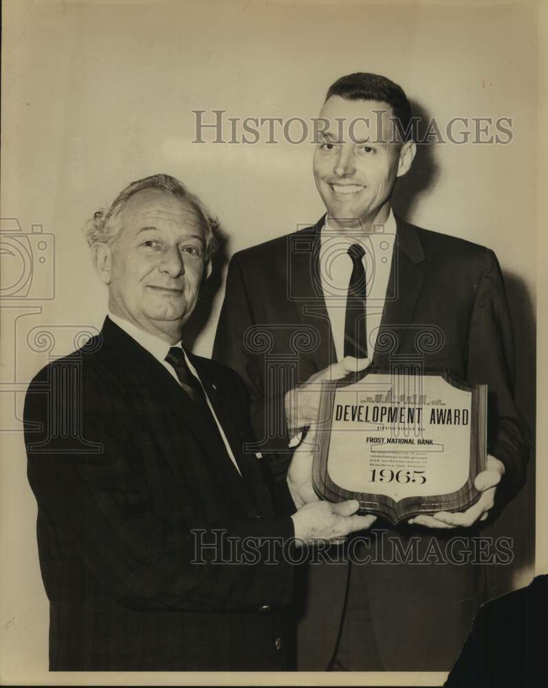 1965 Tom Frost, Jr. receives Development Award from man at Ceremony - Historic Images
