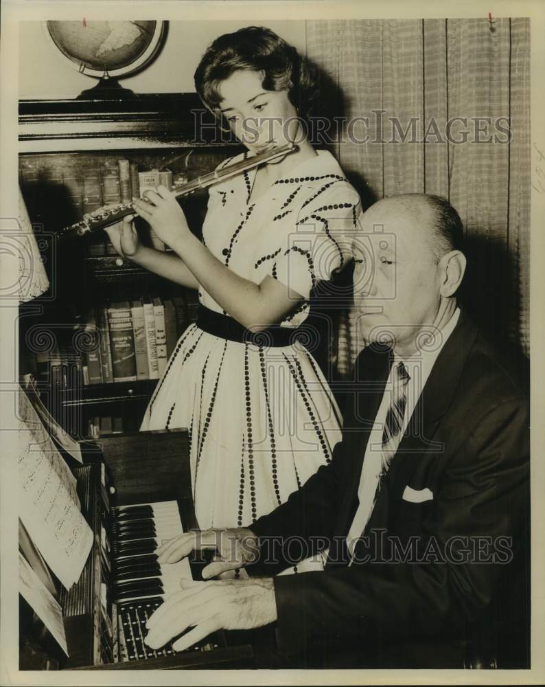 Press Photo Diane Dixon playing flute as Leonard Dixon plays the piano, Texas - Historic Images
