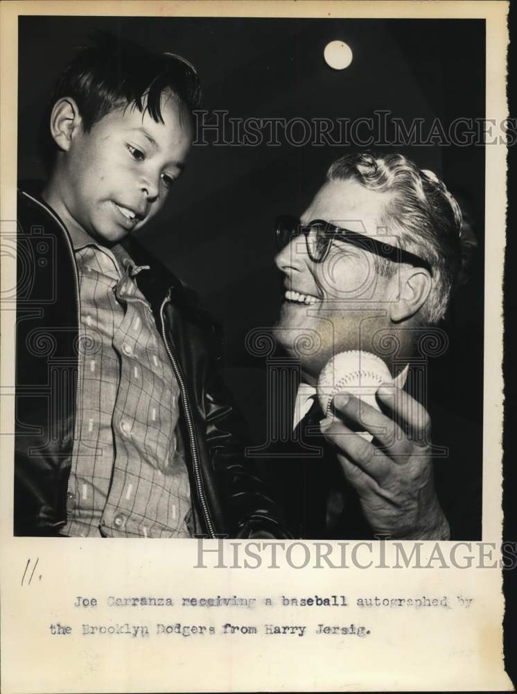 1957 Press Photo Harry Jersig gives Joe Carranza Brooklyn Dodgers baseball - Historic Images