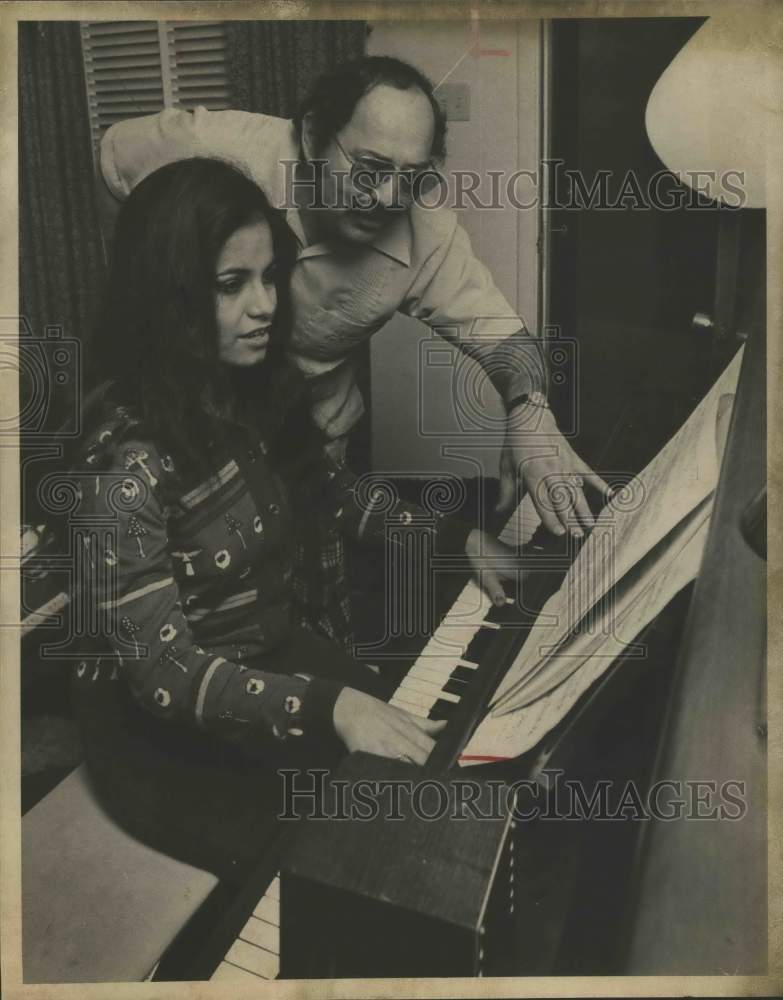 1975 Sergio with Gloria Rodarte playing piano, Texas - Historic Images