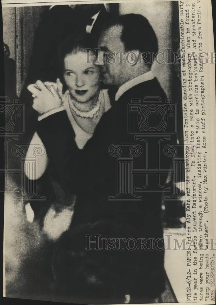 Press Photo Prince Aly Kahn dancing with Joan Fontaine at restaurant in Paris - Historic Images