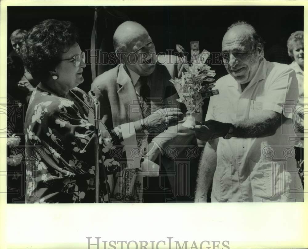 1990 Henry B. Gonzales gets &#39;fake&#39; money tree for birthday, Texas-Historic Images