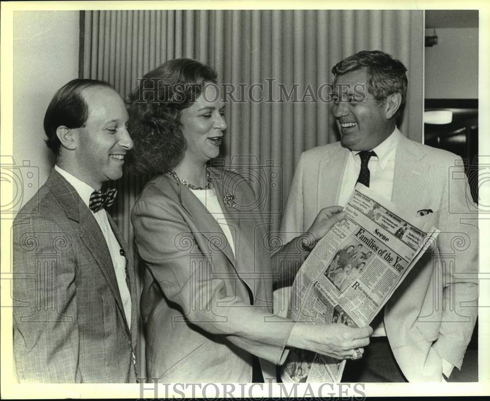 1989 Steering Committee Members read Family of the Year news, Texas-Historic Images