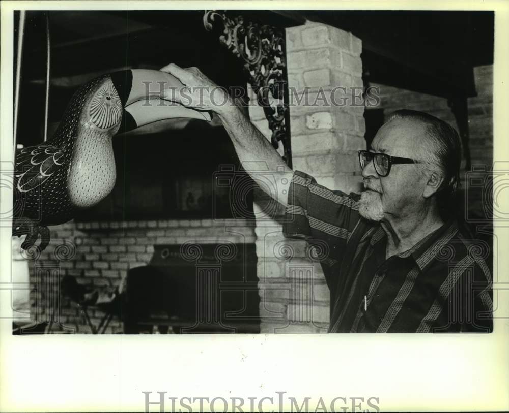 1989 Historian Henry Hauschild with &quot;Toucan&quot; on his patio, Texas-Historic Images