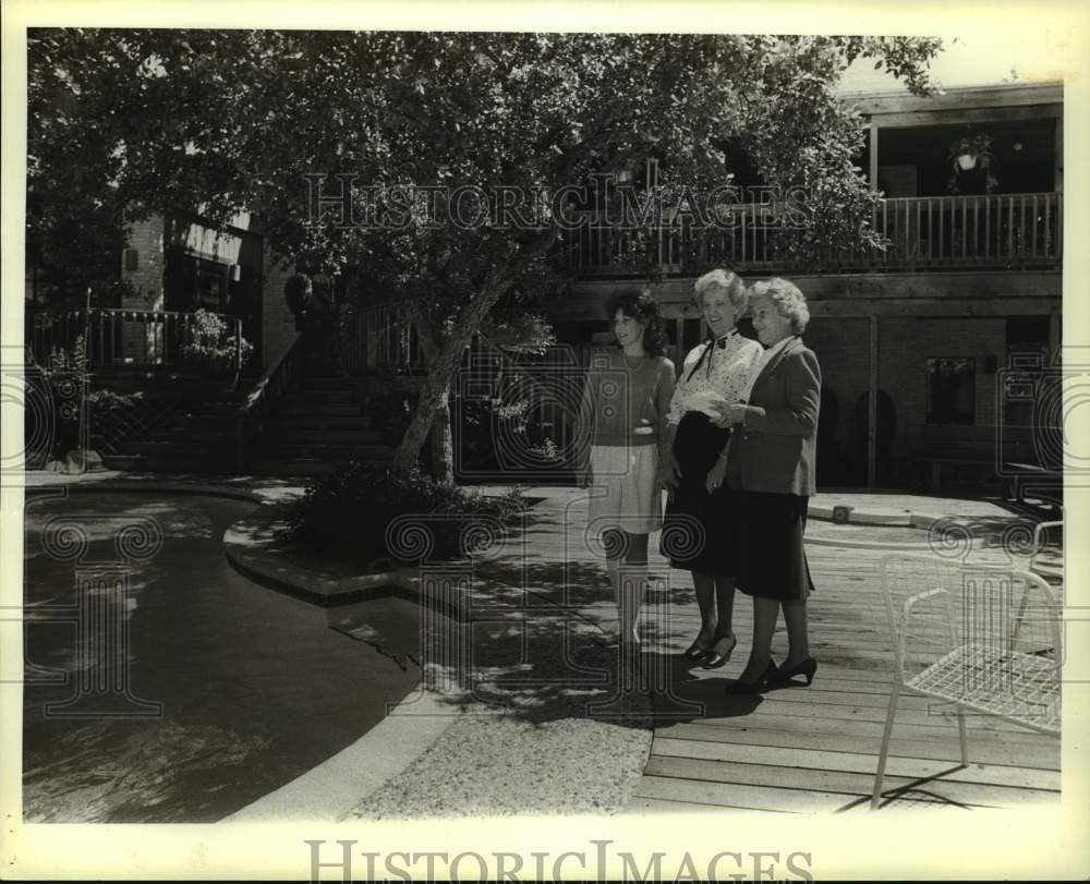 1983 Ladies standing by pool at home on Morgan&#39;s Creek, Texas-Historic Images