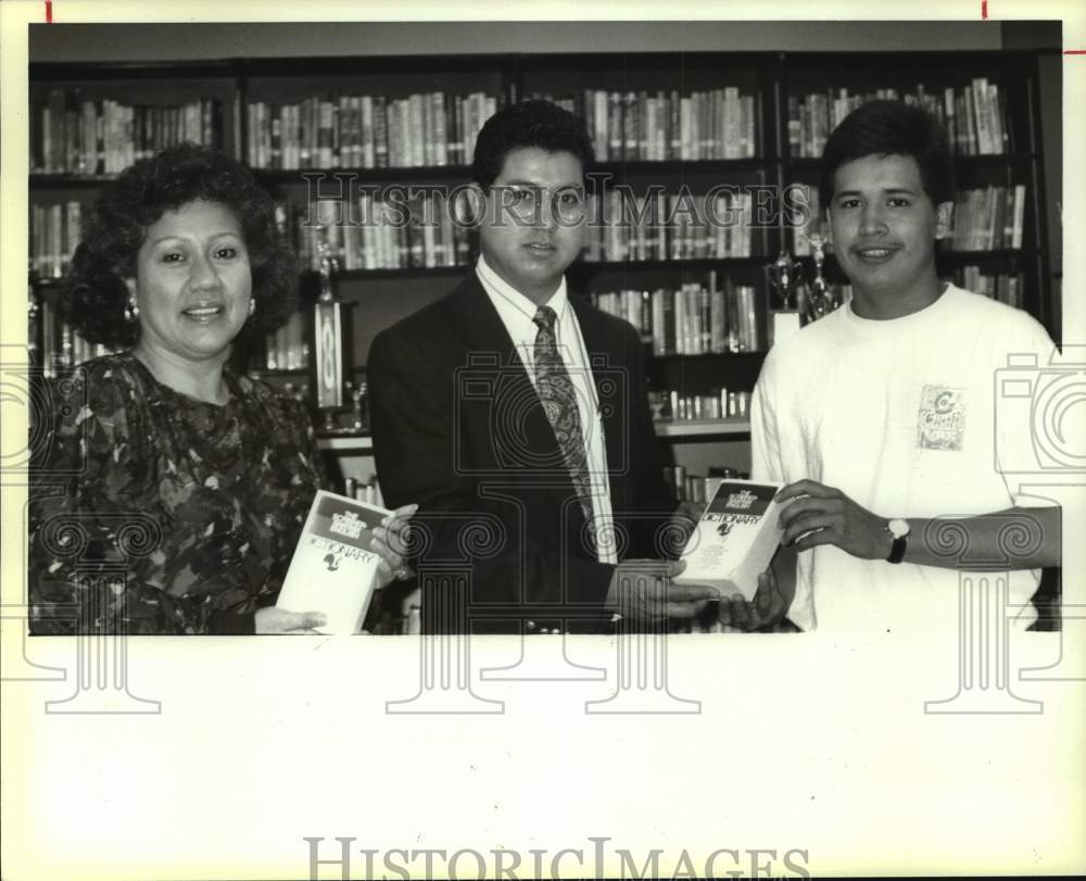 1990 Student and sponsors hold Lanier High School dictionary, Texas-Historic Images