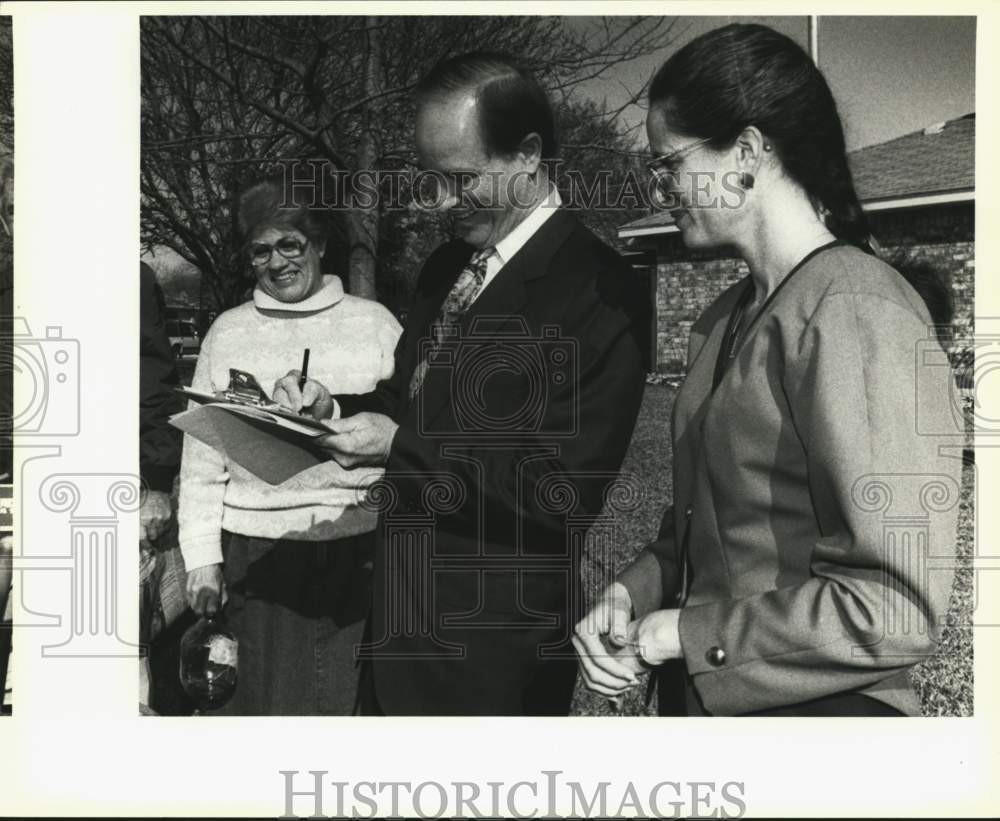 1992 Mayor Wolff signs petition for curbside recycling pickup, Texas-Historic Images