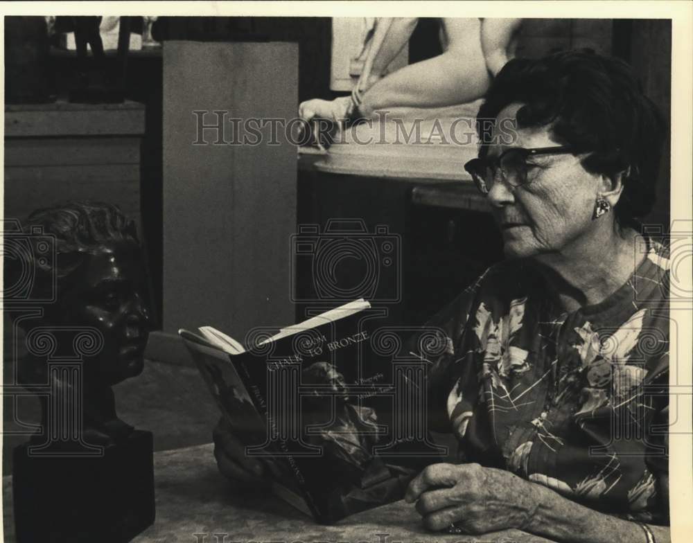 1978 Sculptress Waldine Tauch reading her biography, Texas-Historic Images