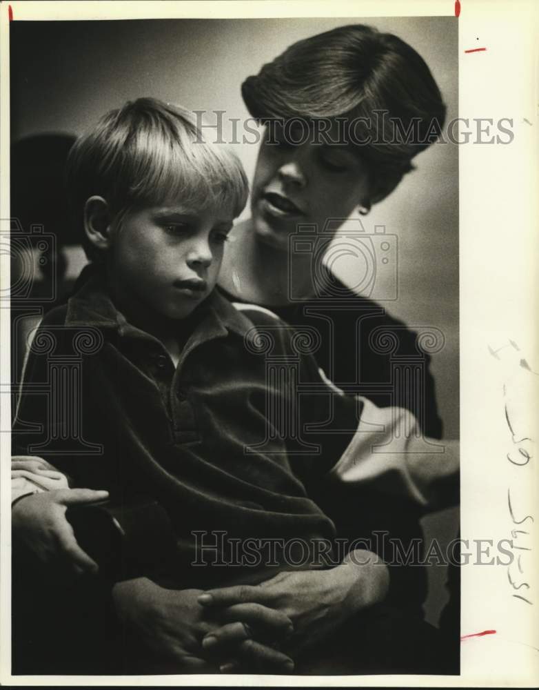 1983 Priscilla Griffis holds her son Jim Griffis, a leukemia patient-Historic Images