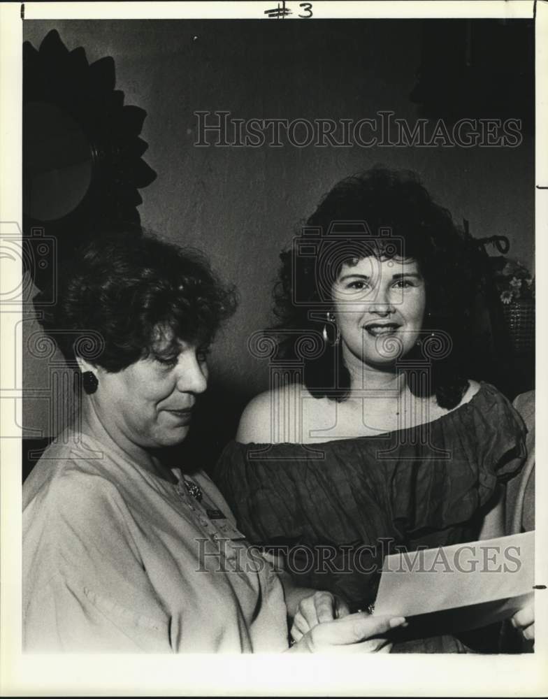 1989 Penny Lamond and Shirley Wills look over festival agenda.-Historic Images