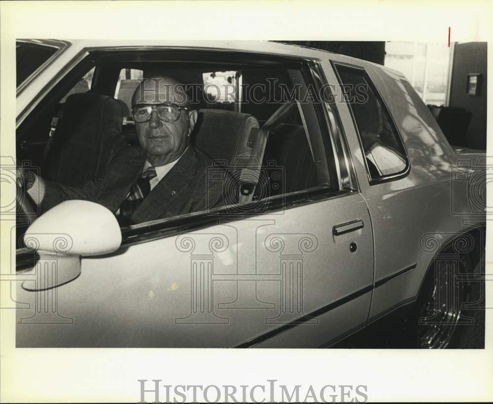 1984 C. C. Gunn, Sr. of Gunn Oldsmobile, in one of his cars, Texas-Historic Images