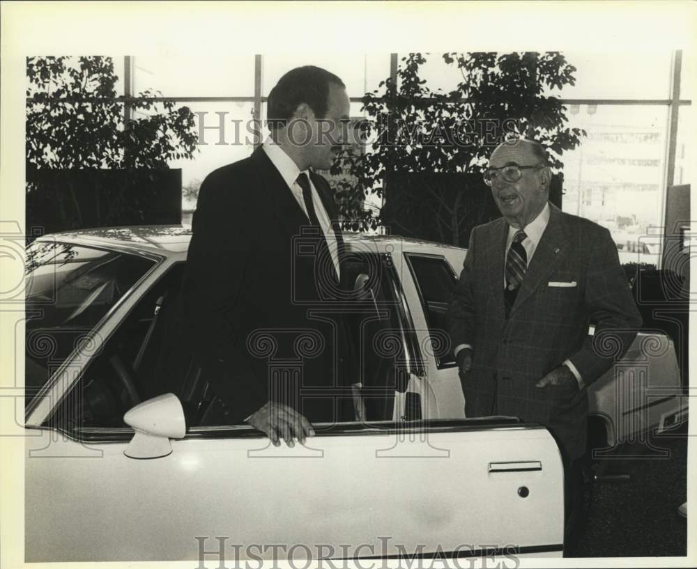 1984 C. C. Gunn Sr, with George Olivera at Gunn&#39;s Oldsmobile, Texas-Historic Images