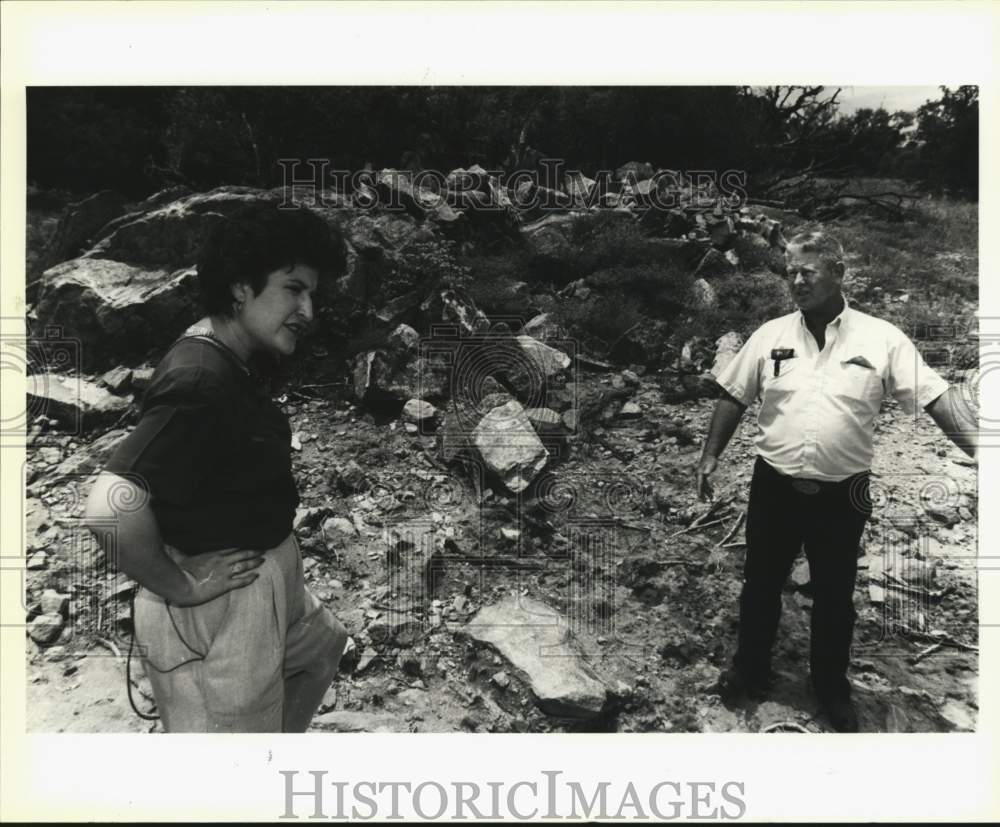 1982 Texas Landowner Coalition president inspecting land, Texas-Historic Images