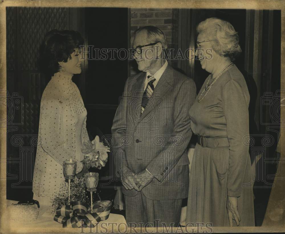 Mrs. Daniel J. Cuellar visiting with Mr. and Mrs. Thomas S. West-Historic Images