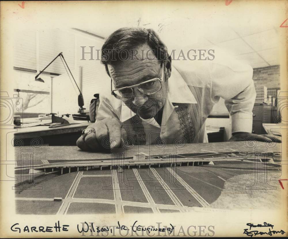 Garrette Wilson Jr., Highway Engineer, shows model, Texas-Historic Images