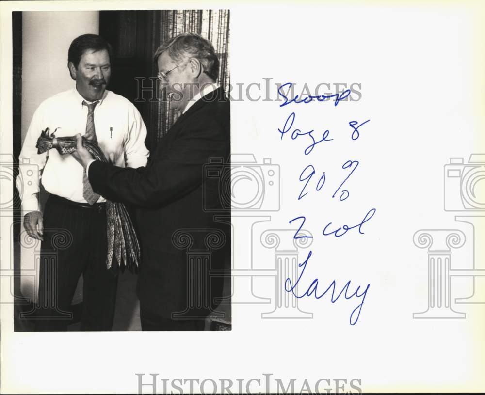 1994 W. Lawrence Walker gets Christmas ties from Bob Thornton, Texas-Historic Images