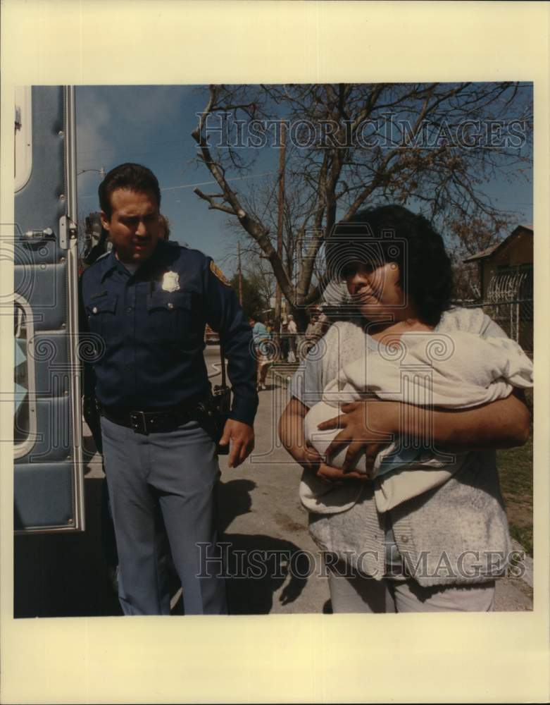 1988 Antonia Moreno with baby at fire scene in San Antonio, Texas-Historic Images
