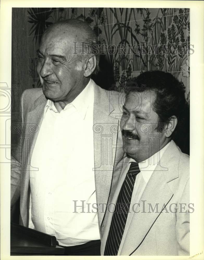 1983 Ralph Karam And Roger Flores Share Smiles At Podium-Historic Images