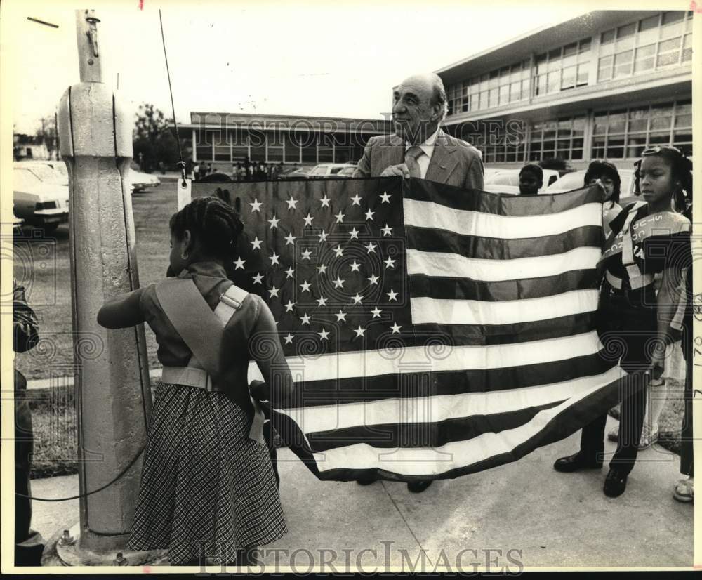 1984 John J. Pershing Elementary students hanging new flag, Texas-Historic Images