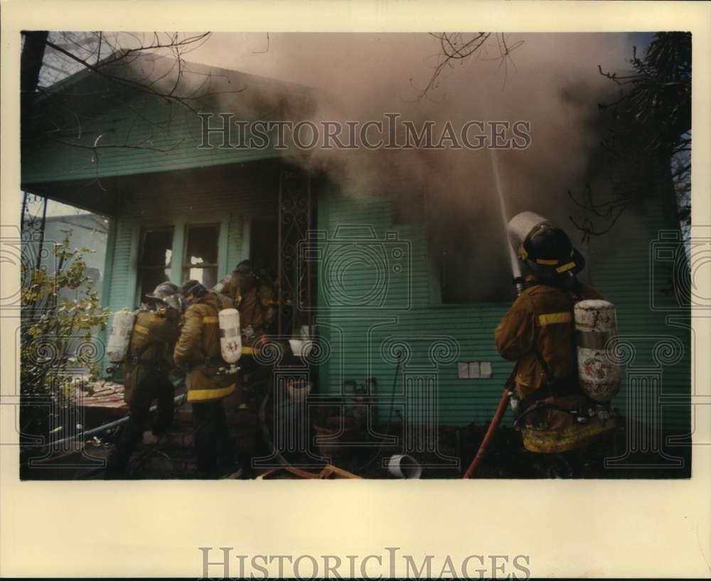 1988 Fireman extinguishing fire at 17 North Sabinas, Texas-Historic Images