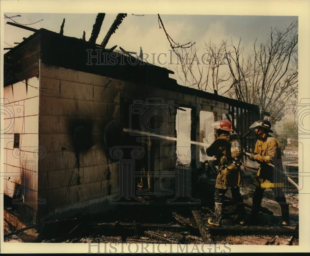 1988 Firemen at scene of fire at 207 Early Way, Texas-Historic Images