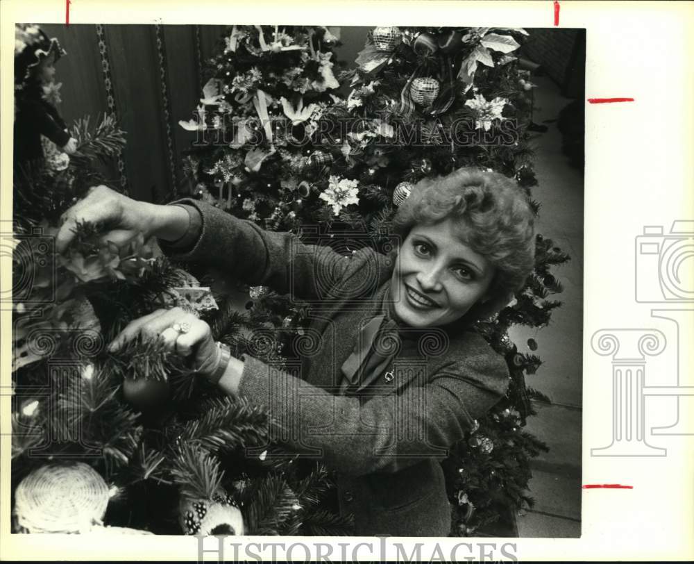 1983 Karla Wentworth decorating tree for &quot;Festival of Trees,&quot; Texas-Historic Images