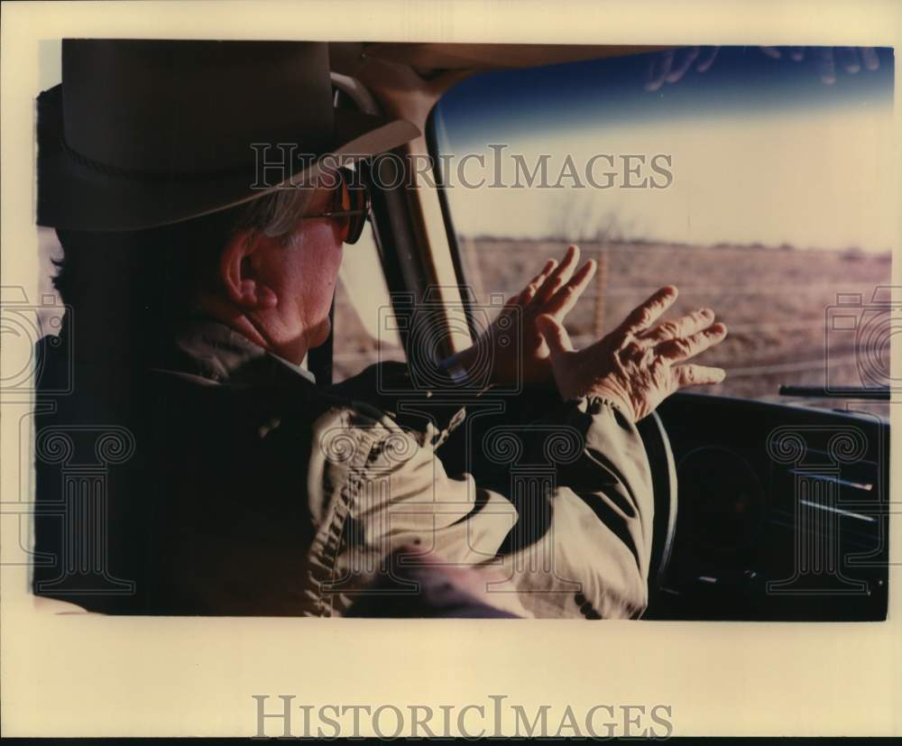Rancher Belton K. Johnson Gestures While Driving His Truck-Historic Images
