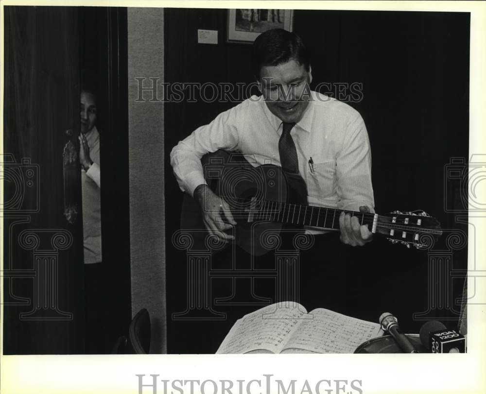 1985 Judge Tom Vickers playing his guitar at Christmas Party, Texas-Historic Images